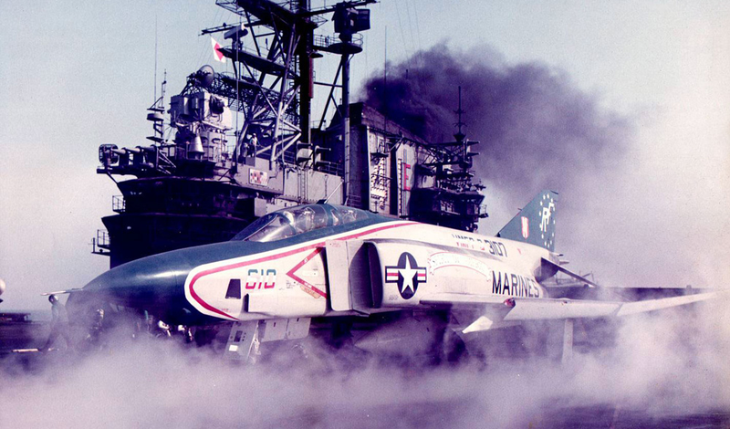 A US Marine Corps RF-4B Phantom II from Marine photo reconnaissance squadron VMFP-3 Eyes of the Corps prepares to launch from the USS Midway in 1976. Note the camera ports in the nose, as well as the Bicentennial livery on the aircraft. (Chuck Walters, USMC)